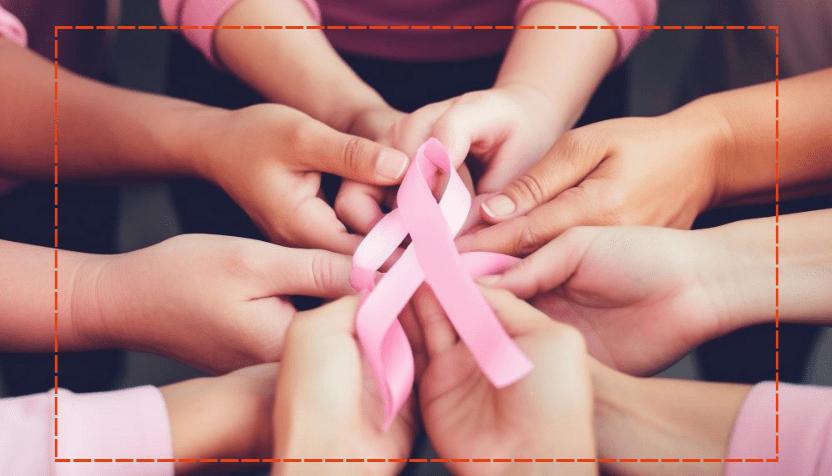 mulheres segurando laço rosa simbolizando o outubro rosa